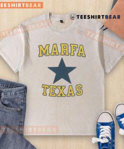 Nice Jensen Ackles wearing a Marfa, Texas washed t-shirt, showcasing a casual style in a scenic outdoor setting.