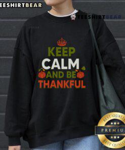 Alt Text: Cozy Thanksgiving sweatshirt featuring 'Keep Calm and Be Thankful' design, perfect for holiday celebrations.