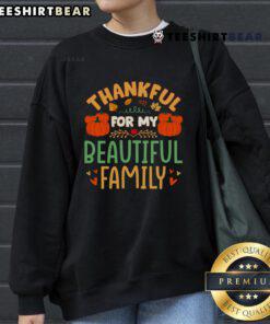 Alt Text: Cozy Thanksgiving sweatshirt saying 'Thankful for My Beautiful Family' worn by a smiling person surrounded by loved ones.