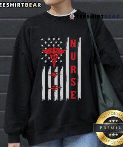 Alt Text: Official Red Nurse Caduceus sweatshirt featuring American flag and ECG heartbeat design, perfect for healthcare professionals.