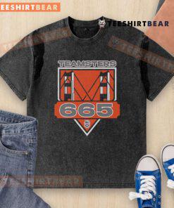 Alt Text: Original Teamsters Local 665 washed t-shirt displayed on a wooden background, showcasing its vintage design and logo.