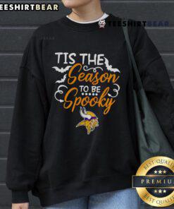 Cozy Minnesota Vikings sweatshirt for Halloween, featuring 'Tis The Season To Be Spooky' design in team colors.