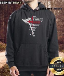 Premium 'My Favorite Nurse Calls Me Mom' hoodie featuring caduceus cross design, perfect for nurse moms.