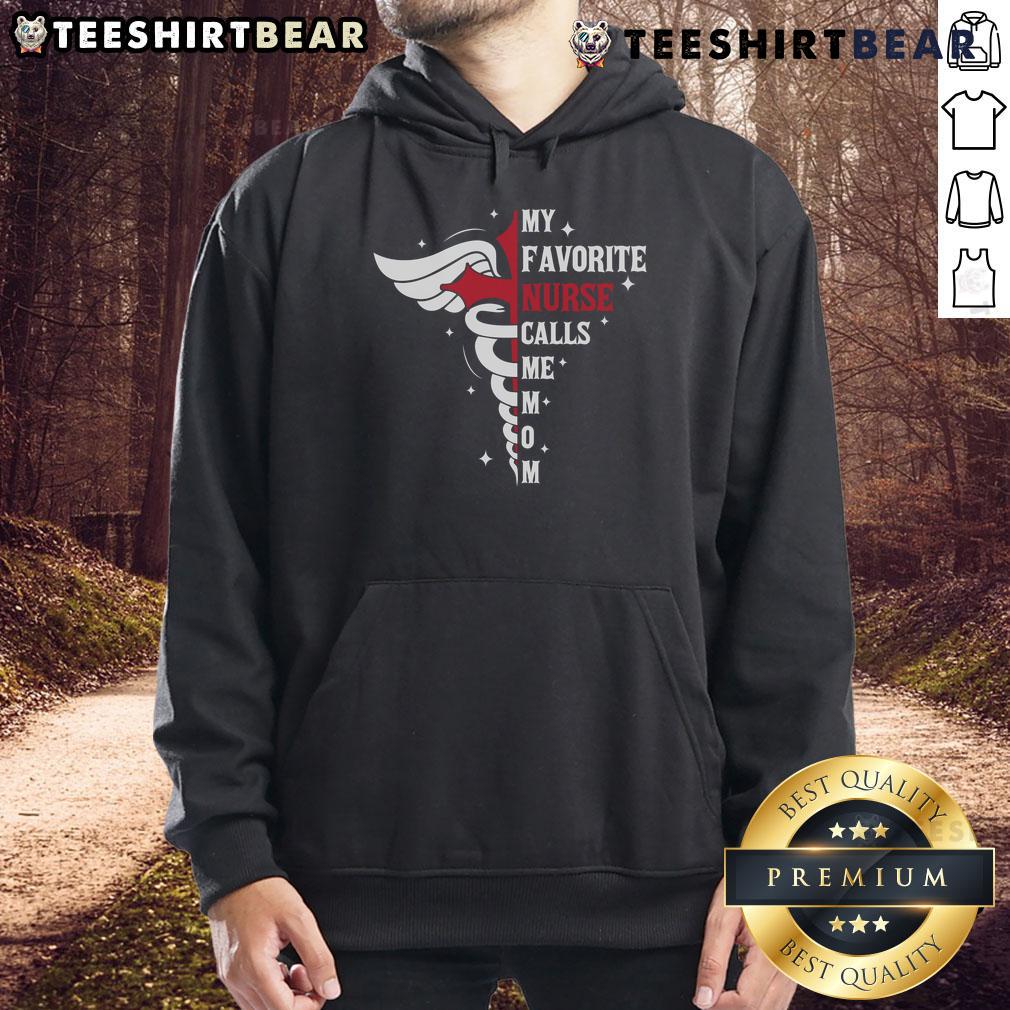 Premium 'My Favorite Nurse Calls Me Mom' hoodie featuring caduceus cross design, perfect for nurse moms.