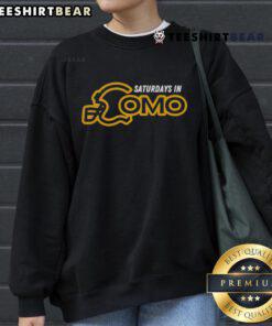 Cozy Premium Saturdays in CoMo sweatshirt displayed on a wooden table, perfect for casual wear and comfort.