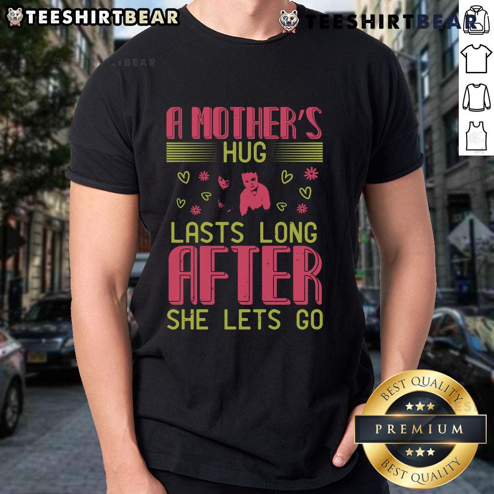 Pretty A Mother's Hug Lasts Long After She Lets Go T-Shirt design featuring heartfelt typography and colorful graphics.