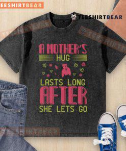 Mom embracing child in a heartfelt moment, showcasing love. Perfect for the 'Pretty A Mother's Hug Lasts Long' T-shirt.