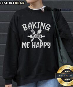 Cozy 'Pretty Baking Makes Me Happy' sweatshirt in a warm kitchen setting, perfect for baking enthusiasts and comfort lovers.