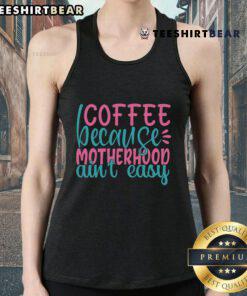 Pretty Coffee Because Motherhood Ain't Easy tank top featuring a stylish design for moms who love coffee and comfort.
