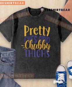 Pretty Eyes and Chubby Thighs washed t-shirt displayed on a hanger, showcasing its soft fabric and stylish design.