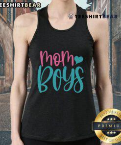Pretty mom wearing a stylish tank top with her two boys in a sunny outdoor setting, showcasing family love and fashion.