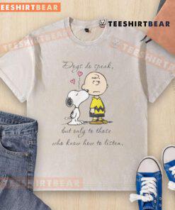 Alt Text: Pretty Snoopy Peanuts dogs graphic on a washed t-shirt, featuring the quote about listening to dogs.