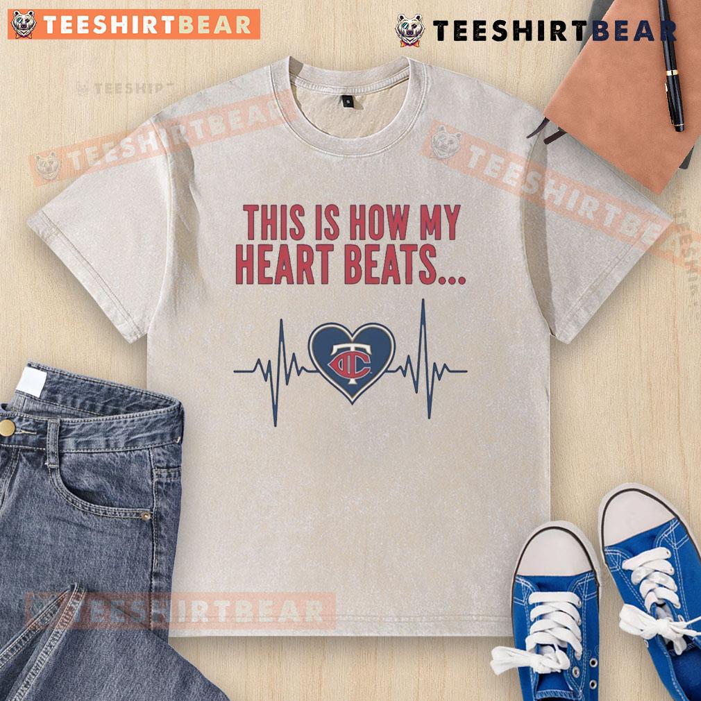 Alt Text: Pretty This Is How My Heart Beats Minnesota Twins washed t-shirt displayed on a hanger, showcasing team spirit.