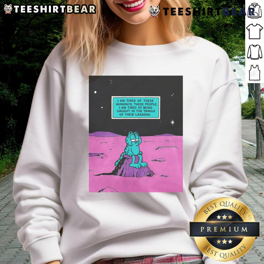 Cozy sweatshirt with 'I Am Tired Of These Mondays' print, perfect for casual wear and embracing comfy vibes.