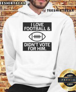 Top 'I Love Football And Didn't Vote For Him' hoodie featuring bold text design, perfect for football fans.
