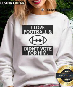 Cozy 'I Love Football And Didn't Vote For Him' sweatshirt in navy blue, perfect for football fans and casual wear.