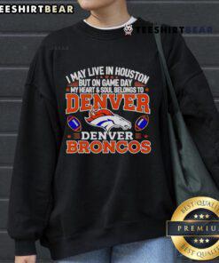 Alt Text: Cozy sweatshirt featuring I May Live in Houston, But My Heart Belongs to Denver Broncos design, perfect for game day.