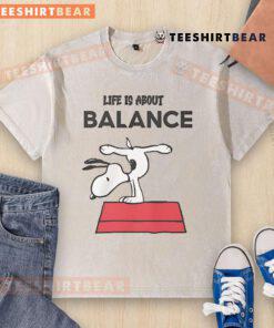 Top Snoopy Life Is About Balance Washed T-Shirt featuring a playful Snoopy graphic and relaxed fit for casual style.