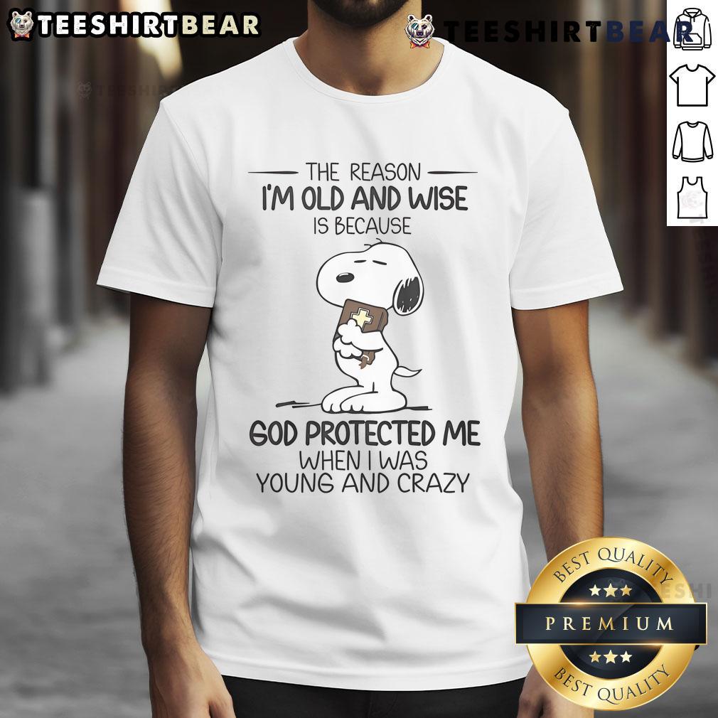 Top Snoopy T-shirt featuring 'The Reason I'm Old and Wise' quote, perfect for fans of Peanuts and nostalgic apparel.
