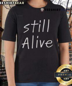 Top Still Alive Ladies Tee featuring bold graphic design and comfortable fit, perfect for casual wear and stylish outfits.