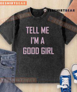 Alt Text: Top Tell Me I'm A Good Girl washed t-shirt displayed on a hanger, showcasing its stylish design and soft fabric.