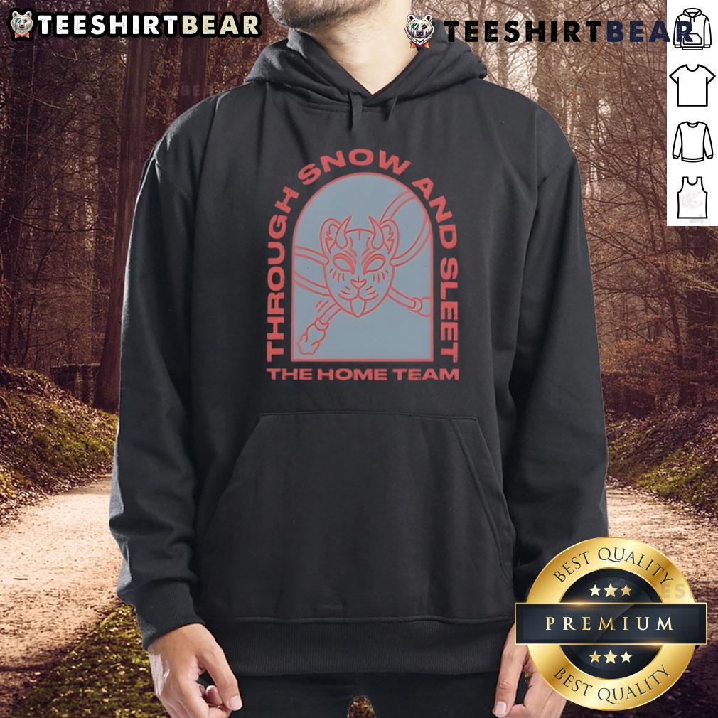 Cozy Top The Home Team hoodie worn during snowy weather, perfect for fans braving snow and sleet outdoors.