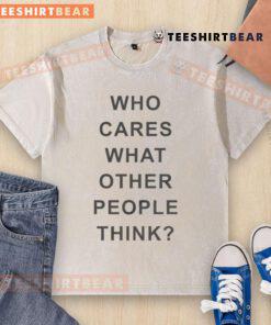 Alt Text: Top Who Cares What Other People Think washed t-shirt displayed on a wooden background, promoting self-expression.