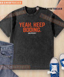 Top Yeah Keep Booing Ram Washed T-Shirt displayed on a hanger, showcasing its unique design and vibrant colors.