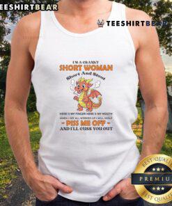 Cranky short woman in a tank top with 'Piss Me Off' graphic, embracing her short and stout personality.