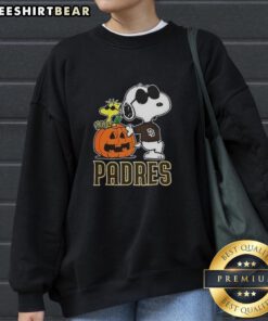 Alt Text: Awesome Snoopy San Diego Padres MLB pumpkin Halloween sweatshirt featuring Peanuts cartoon design for 2025.