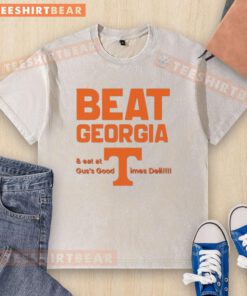 Awesome Tennessee Volunteers beat Georgia, showcasing a washed T-shirt from Gus's Good Times Deli in celebration.