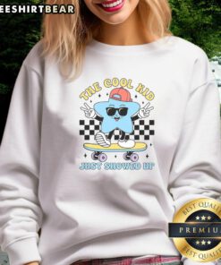 Awesome The Cool Kid Just Showed Up Back To School Sweatshirt in vibrant colors, perfect for stylish students.