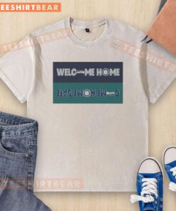 Alt Text: Seattle Seahawks and Mariners washed t-shirt featuring 'Welcome Home' design, perfect for fans.