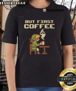Funny 'But First Coffee' tee featuring retro Zelda pixel art for gamers, perfect for ladies who love gaming fashion.