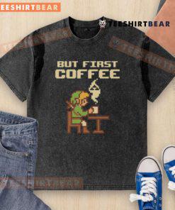 Alt Text: Retro gamer pixel art washed t-shirt featuring Funny But First Coffee inspired by The Legend of Zelda.