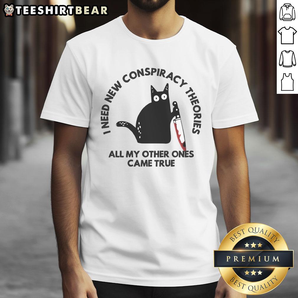 Funny cat on a T-shirt with the text 'I Need New Conspiracy Theories All My Other Ones Came True' for cat lovers.