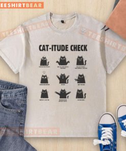 Funny cat wearing a washed t-shirt with a quirky attitude, showcasing a playful cat-itude check.