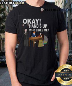Funny Okay Hand T-Shirt with 'Who Likes Me' text, perfect for humor lovers and casual wear enthusiasts.