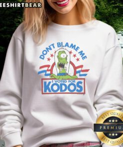 Alt Text: Funny The Simpsons Don't Blame Me I Voted For Kodos Sweatshirt featuring cartoon characters and humorous design.