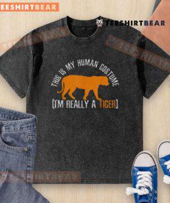 Alt Text: Funny This Is My Human Costume, I'm Really A Tiger washed t-shirt design featuring a playful tiger graphic.