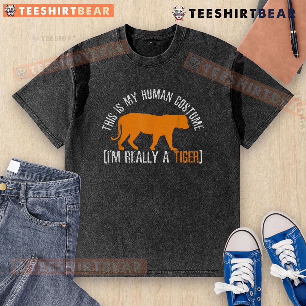 Alt Text: Funny This Is My Human Costume, I'm Really A Tiger washed t-shirt design featuring a playful tiger graphic.