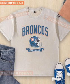 Alt Text: Distressed vintage washed t-shirt featuring a Denver Broncos football helmet design, perfect for fans.