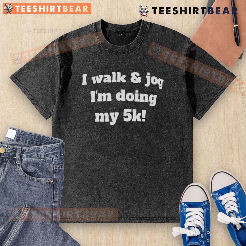 Person wearing a washed t-shirt that says 'Good I Walk and Jog' during a 5K run, showcasing fitness and motivation.