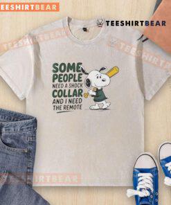 Alt Text: Good Snoopy baseball bat graphic on a washed t-shirt with the quote about needing a remote, perfect for Snoopy fans.