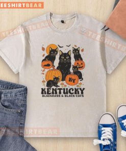 Alt Text: Good The Bluegrass and Black Cats Halloween pumpkin design on a washed t-shirt for festive fall fashion.