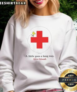 Nice Snoopy Blood Drive sweatshirt featuring a playful design, promoting the message 'A Little Goes A Long Way' for charity.