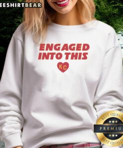Official engaged sweatshirt featuring KC Travis Kelce and Taylor designs, perfect for fans celebrating their love.