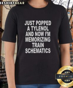 Premium ladies tee featuring a fun graphic of popping Tylenol and memorizing train schematics, perfect for quirky fashion.
