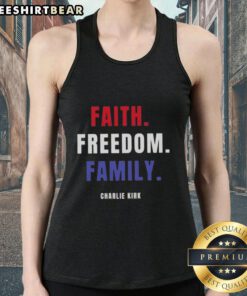 Charlie Kirk wearing a 'Top Faith Freedom Family' tank top, promoting conservative values and family unity.