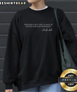 Charlie Kirk sweatshirt featuring the quote 'Freedom Is Not Free; It Must Be Fought For And Defended' in bold lettering.